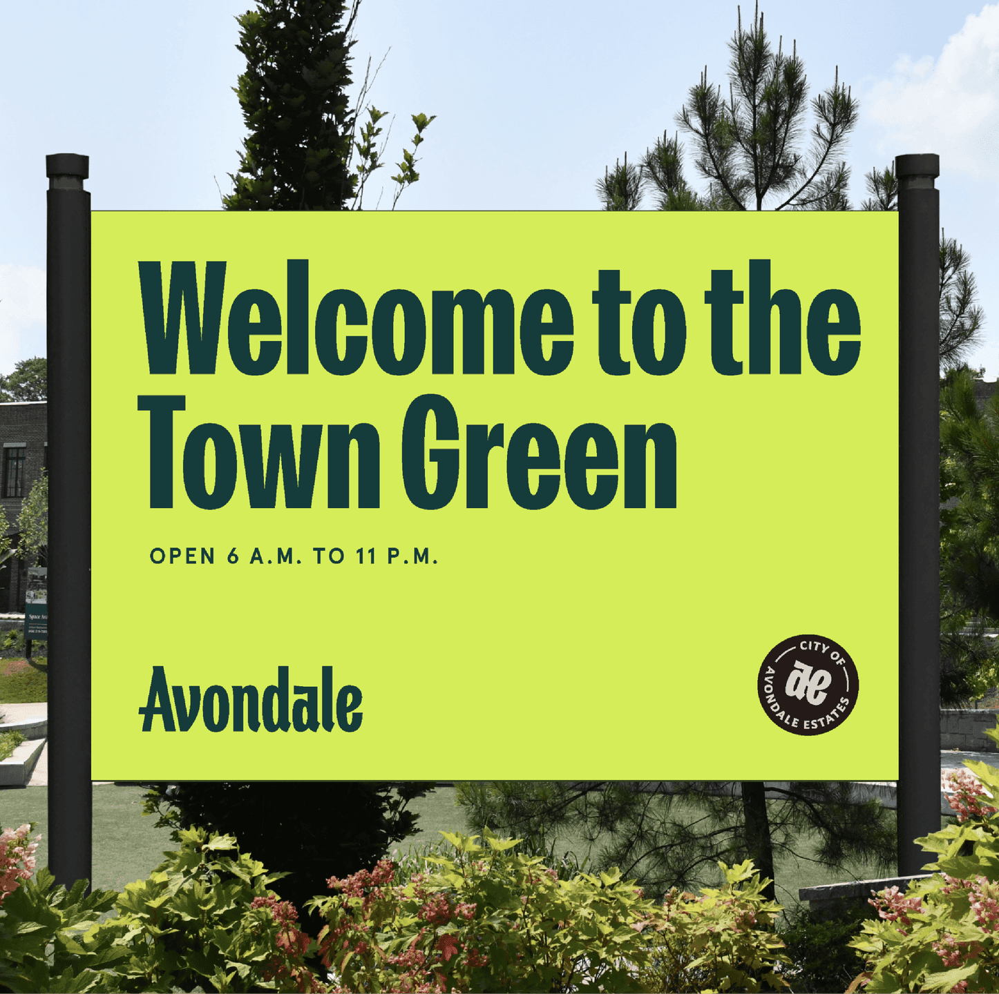 Avondale Town Green Sign. A bright lime-green sign welcomes visitors to the Avondale Town Green, featuring the city’s logo and park hours.
