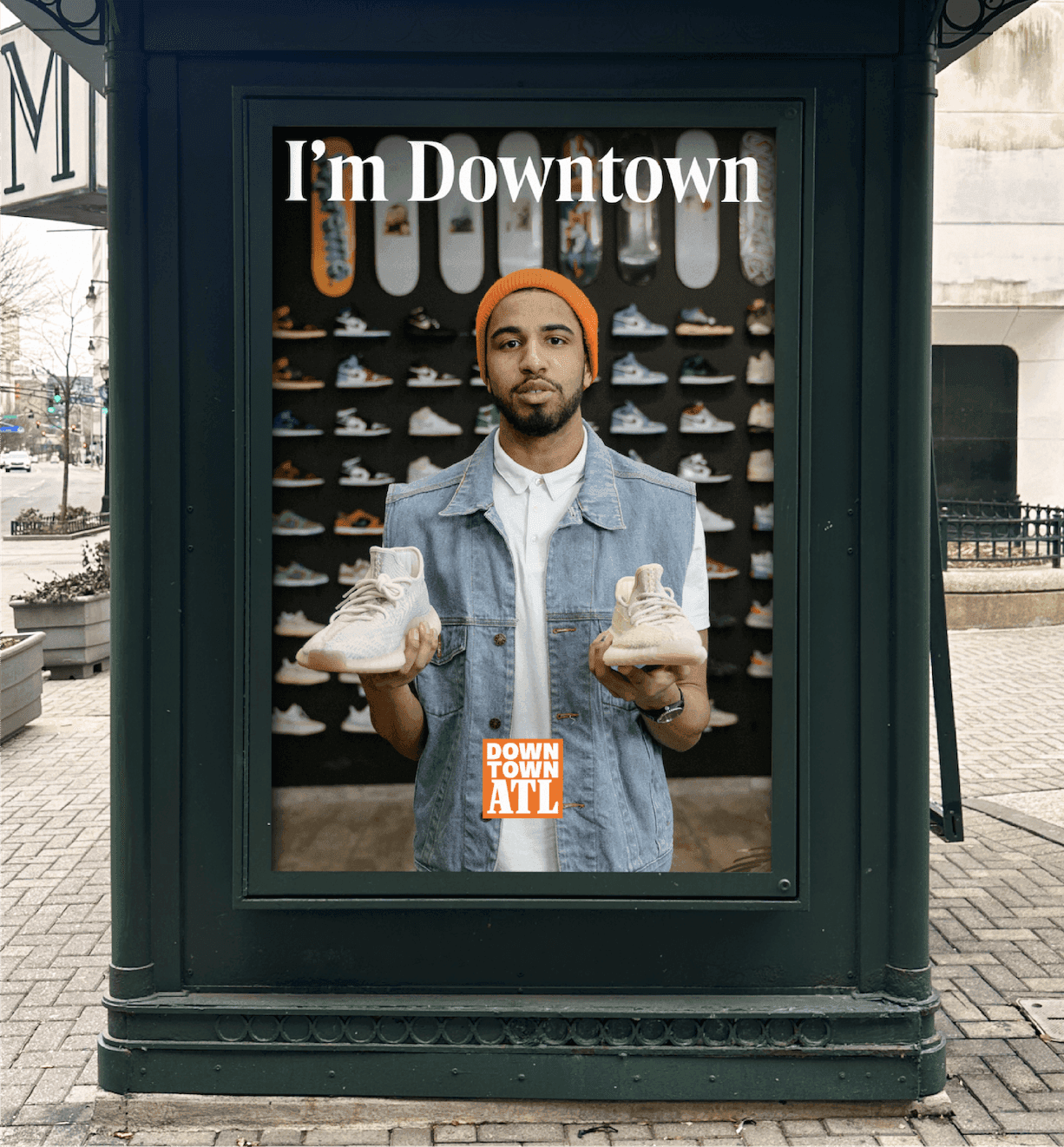 “I’m Downtown” Poster. A Downtown ATL poster features a local shop owner holding sneakers beneath the headline “I’m Downtown.”