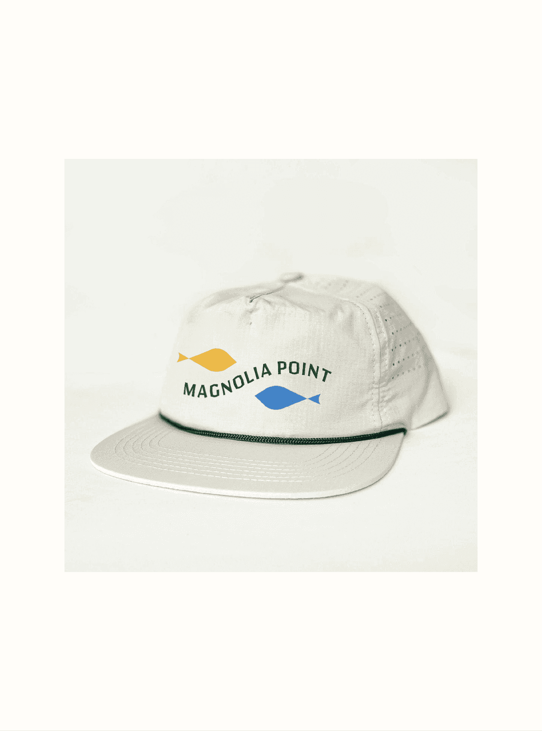 Branded cap. A light-colored Magnolia Point hat embroidered with two fish icons and the restaurant’s name.