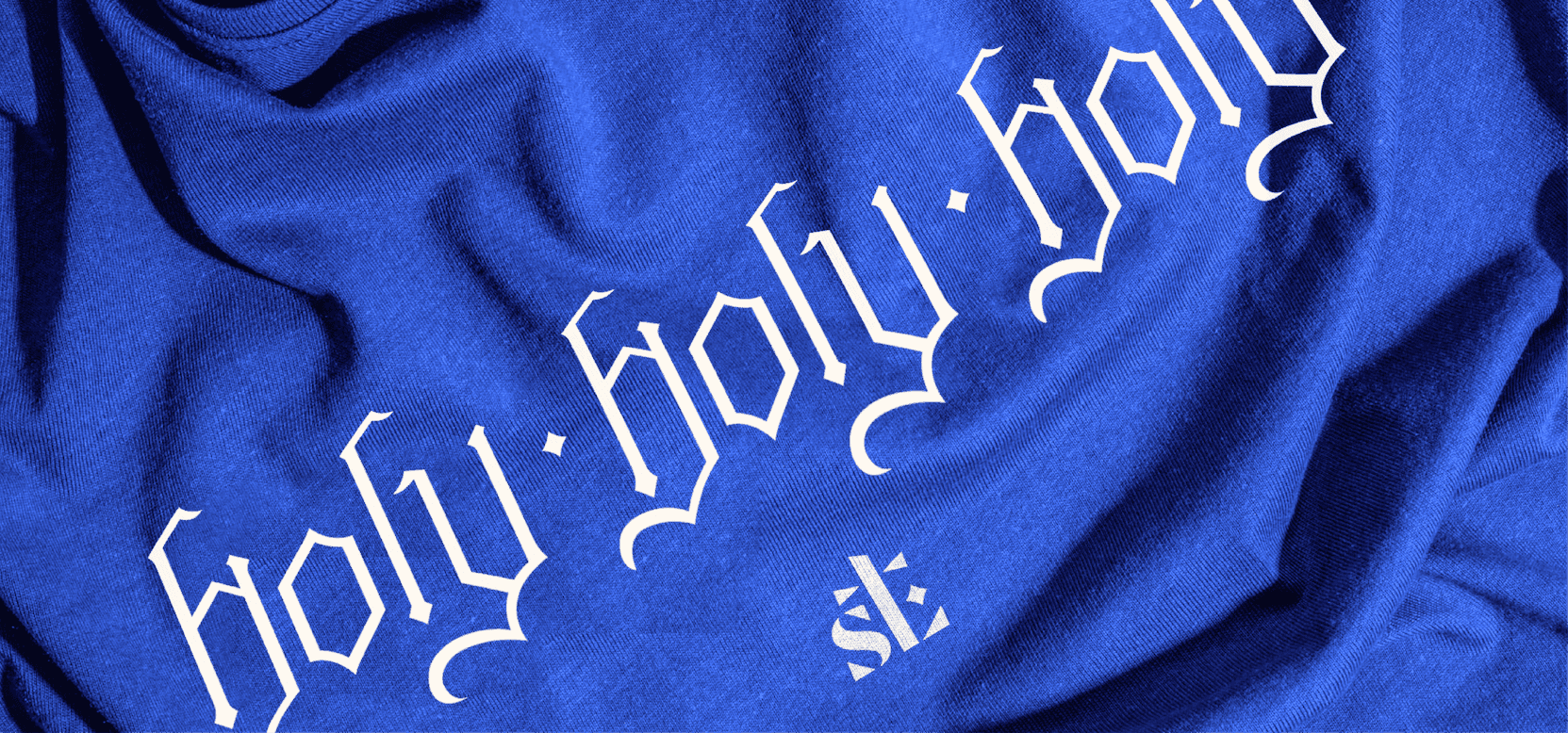 Holy, Holy, Holy” Shirt Blue St. Luke’s shirt with a gothic “Holy, Holy, Holy” design and church monogram.